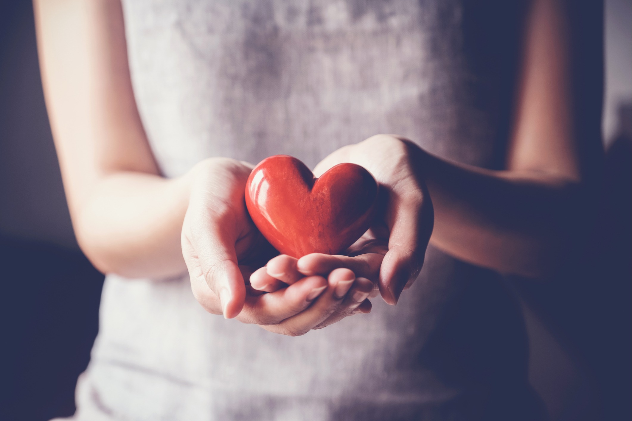 Woman holding a heart in her hands